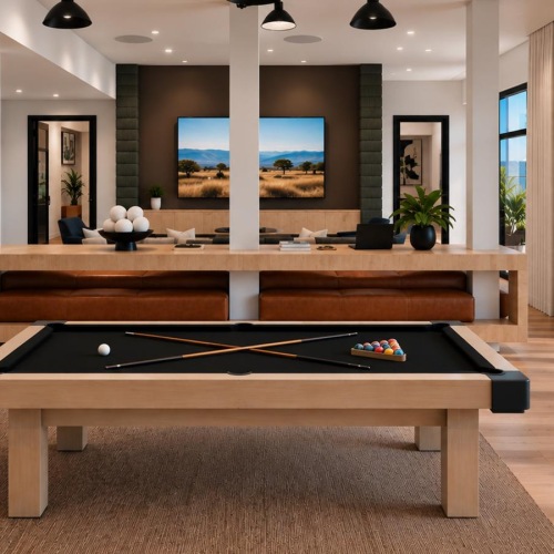 a room with a pool table and a large screen