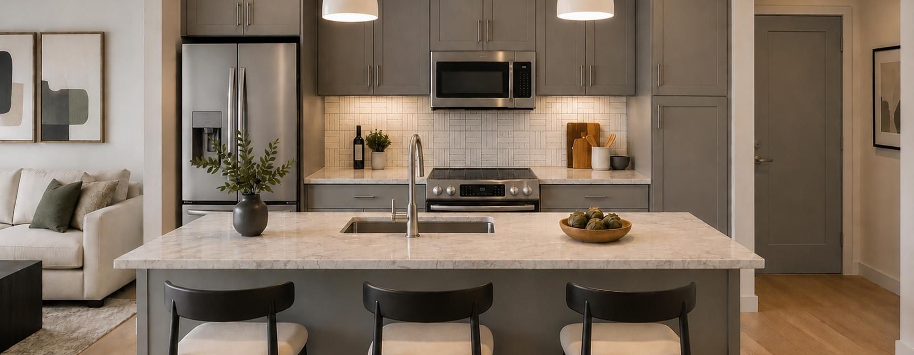 a kitchen with a marble island