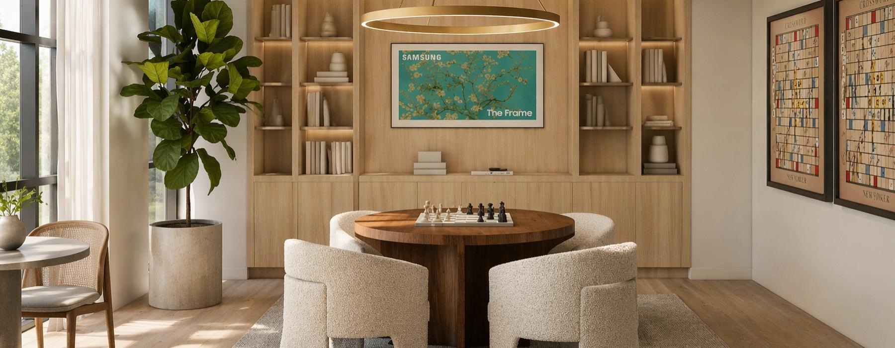 a room with a table chairs and a plant